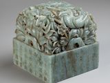 a sculpture of a box with a bunch of flowers inside of it