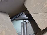 a cardboard box that has a bunch of tools inside of it