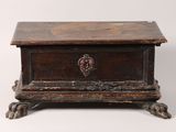 an old wooden box with a heart on the lid