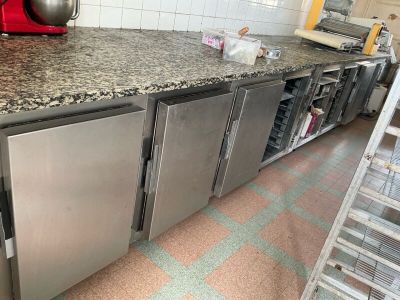 a kitchen with stainless steel appliances and granite counter tops