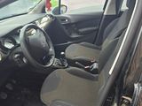 the interior of a car with the door open and the driver ' s seat up
