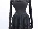 a black lace dress with long sleeves and a high neckline
