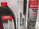 two cans of motor oil and a can of motor oil next to each other