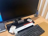 an image of a computer desk with a keyboard and a monitor