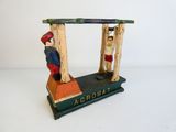 a toy figurine of a man and a woman on a bench