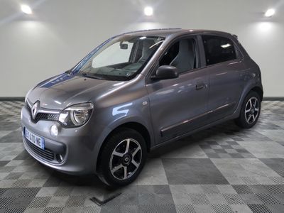 a picture of a silver car parked in a garage