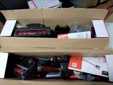 a box with two vacuums in it sitting on a table