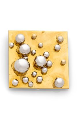 an image of a close up of a metal object on a white surface