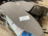a surfboard with a sticker on it sitting on the floor