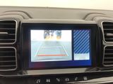 a picture of a car dashboard with a monitor in it