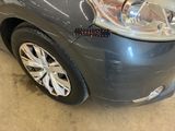 a close up of a car ' s headlight and front bumper