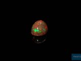 an oplite in the dark with a green light on it