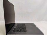 a laptop that is sitting on a white surface