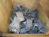 many pieces of metal in a wooden box