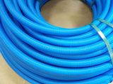 a close up of a blue hose on a table