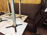 four chairs and a table in the corner of a room