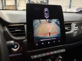 a picture of a car ' s dashboard with a camera mounted on it