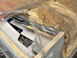 a box with some food inside of it that is wrapped in plastic