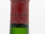a bottle of wine that is sitting on a table