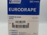 La boîte d'Eurodrape est posée sur une surface blanche.
