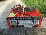 an electric charger sitting on the side of the road