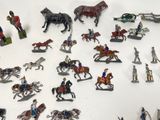 a lot of figurines that are sitting on a table
