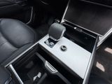an image of a car interior with the center console open
