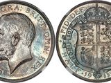 a close up of a coin with a man ' s face on it