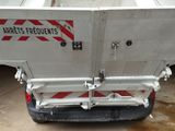 a white truck with a red and white stripe on it