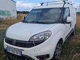 a white van that is parked in the grass