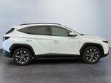 the white toyota rav is parked in a room with gray walls