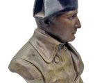 statue of a bust of a man with a hat on top of his head