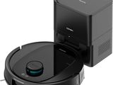 an image of a black robot vacuum cleaner and a black box