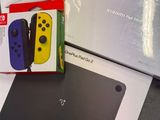 packaging for nintendo switch lite and a box for the nintendo switch lite