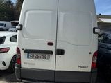 a white van that is parked in a parking lot
