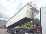 a large white truck with a green and white trailer on the back