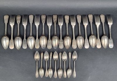 a close up of a bunch of spoons and forks on a table