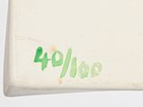 a white box with green writing on the side of it