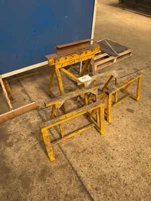 several pieces of wood sit on top of a table in front of a blue wall