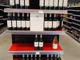 many bottles of wine on the shelves in the store