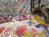 many bags of candy sitting on a table