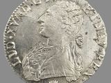 une pièce d'argent portant une tête de femme et une couronne