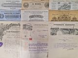 several old papers are stacked on top of each other on a table