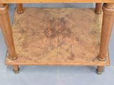 a wooden table with a marble top and wooden legs