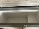a cooler that is sitting on the floor in the room