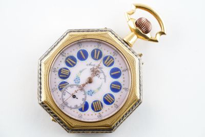 une image d'une montre de poche avec un boîtier en or et un cadran bleu et blanc