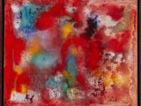 une peinture abstraite aux couleurs rouge, jaune, bleue et verte