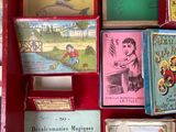 a red display case with many different books on it