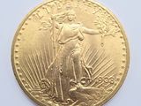 an image of a close up of a gold coin on a white surface