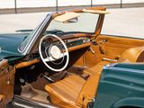 a green and brown convertible car with a wooden steering